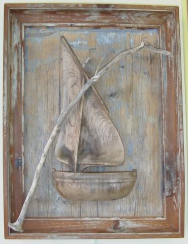 L'artiste Daniel Barre - bateau sculpté sur son cadre brossé